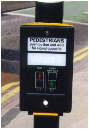 Pedestrian pushbutton for pelican signals in the United Kingdom.