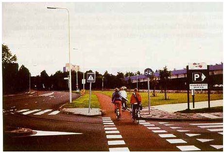 Bicycle path in The Netherlands parallels the high–speed roadway.