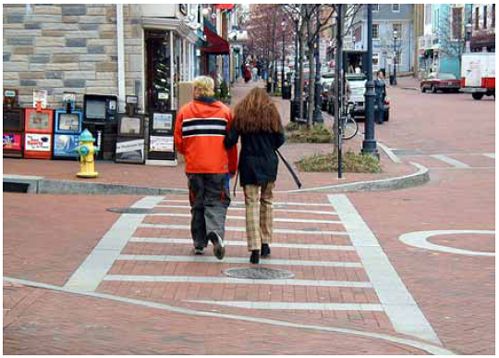 A crosswalk can increase the visibility of a pedestrian path.