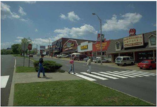 Medians and crosswalks should be placed at destination locations such as this shopping center.