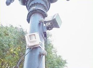 This slide includes four pictures that illustrate examples of different types of pedestrian detection devices. In each picture, a small metal box-like device is attached to a pole and is pointed at the general area where pedestrians are likely to be walking.