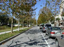 The third photo is from the perspective of the motorist and shows a view from the car while driving down the street.