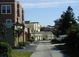 The third picture is of an alleyway behind buildings. There are garage doors visible.