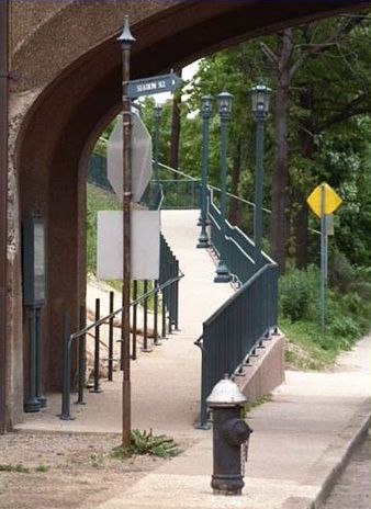 The first picture shows a sidewalk going up an incline with railing on both sides of the sidewalk.