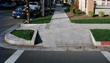 This slide shows three pictures to illustrate different types of pedestrian curb ramps.