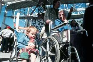 The first picture in the bottom left shows a man in a wheelchair being assisted by another adult. 