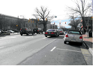 Figure 28. Photograph. Street view of bicycle example 3. This is one of three photographs of the same intersection. This picture, also from the street level, is from the same direction as Figure 27, but closer to the intersection.