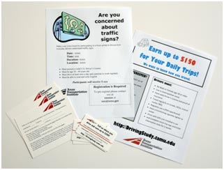 This photo shows different types of flyers and cards that have been used to recruit participants. They range from standard 8.5- by-11-inch flyers, to postcards, to business cards.