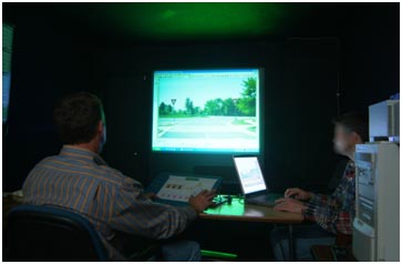 A study participant evaluates signs at a computer in a laboratory.