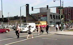 Opposing traffic screens pedestrians from the view of left-turning drivers at this intersection in Chicago, Illinois.