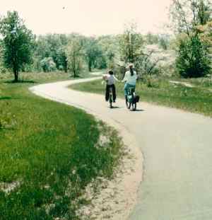 Photos of 2 bicyclists on a bike path