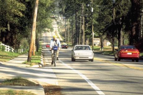 photo of a roadway with a designated bicycle path