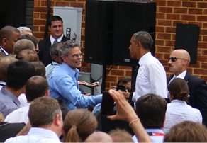 Michael Trentacoste, director of Turner-Fairbank Highway Research Center and Associate Administrator of Research, Development, and Technology, shakes President Obama’s hand.