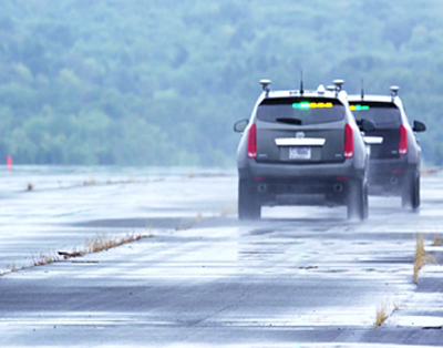 Two Cadillacs demonstrate CV technology.