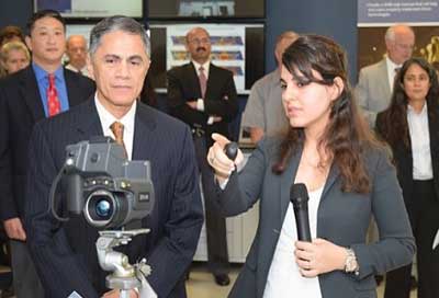 TFHRC NDE Program Manager Hoda Azari demonstrates an infrared-sensitive camera to Deputy USDOT Secretary Victor Mendez.