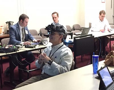 Michael Trentacoste, FHWA’s Associate Administrator for Research, Development, and Technology, participates in a demonstration of the BARRACUDA heads-up display symbology as it would be displayed for a rider negotiating the streets of Boston.