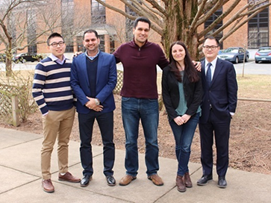 Photograph of five NRC research associates standing outside at the Turner-Fairbank Highway Research Center.