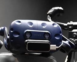 A photograph of a virtual reality headset sitting on top of a bicycle seat.