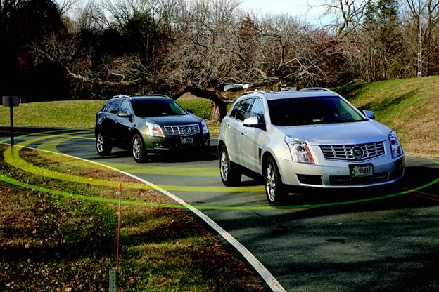 Two of FHWA’s research vehicles with rings indicating that the vehicles are communications with each other. Cooperative adaptive cruise control is the first operational concept that FHWA will test using the five-vehicle research fleet.