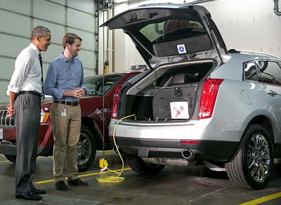 FHWA’s Taylor Lochrane shows President Obama the connected automation technologies built into FHWA’s research vehicle fleet.