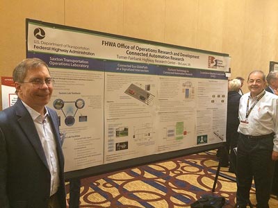 TFHRC’s Bob Ferlis and Osman Altan present a poster on FHWA’s Connected Automation Research at the Automated Vehicles Symposium.