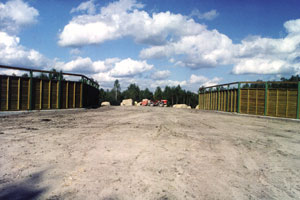 A habitat overpass with board fences on either side