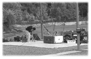 Researcher making adjustments to a high-speed video camera