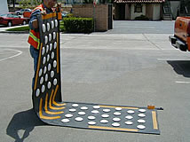 construction worker moving portable speed bump