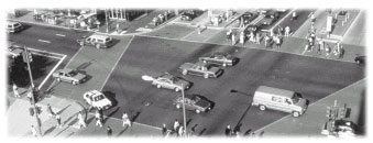 Aerial photo of a busy intersections, unmarked lanes across the center of the intersection 