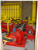 The hydraulic propulsion system, shown here, includes nitrogen tanks (yellow bottles, back left) and a drive system with two hydraulic motors attached at each end.