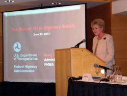 FWHA Administrator Mary E. Peters addresses participants at the National IVI Meeting held in Washington, DC, on June 25, 2003.