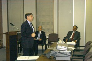 Rick Capka, deputy administrator for FHWA, addresses workshop participants. Also shown from left to right are King W. Gee, associate administrator for infrastructure, and Tommy Beatty, director of the Office of Pavement Technology at FHWA.