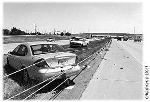 Car crashed into cable barriers protecting opposite roadway