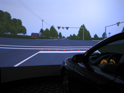 Image of the Highway Driving Simulator showing a simulated signalized intersection