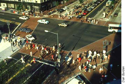Aerial photo of intersection that utilizes varying pavement colors to identify the predestrian crosswalks