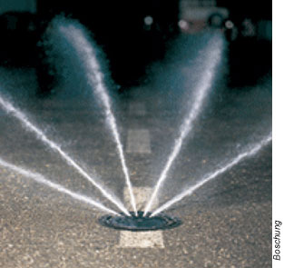 a fixed anti-icing system spraying an anti-ice spray on road surface