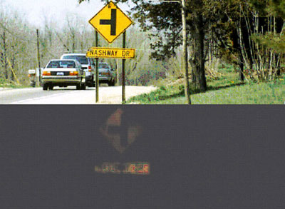 Some signs that are easy to read in daylight, such as the signs in the top photo, may be difficult to read under headlight illumination, such as the signs in the bottom photo.