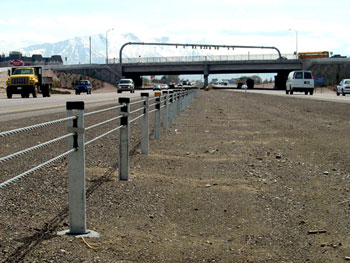 Cable median barriers, such as this one installed on a Utah highway, offer a cost effective way to prevent crossover crashes on roads with traversable medians.
