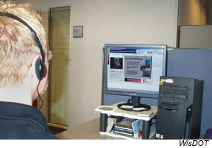 A Webcast arranged by WisDOT enabled geotechnical experts from around the country to participate by computer in the 13th Annual Great Lakes Geotechnical and Geoenvironmental Conference. A Webcast participant sitting at a computer is viewing a presenter in one window on the screen and the presenter’s slides in another.