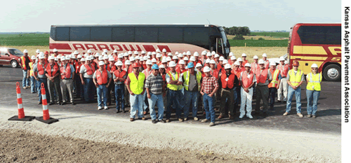 During a recent workshop on perpetual pavements, participants traveled to Brown County, KS, to view a section of perpetual pavement designed with a 50-year lifespan. A large group of participants is shown here standing outside their buses at the Brown County site.