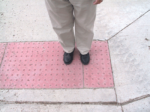 To enhance safety for people who are visually impaired, ADA accessibility guidelines require that truncated dome surfaces, like the one shown here, be installed on new curb ramps and any alterations to existing ramps.
