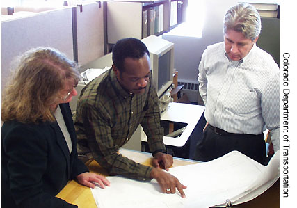 Shown here is a relocation assistance agent meeting with property owners. (Photo Credit: Colorado Department of Transportation)