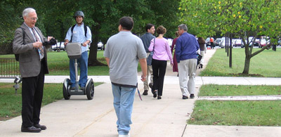 A Segway rider moving among sidewalk users at TFHRC