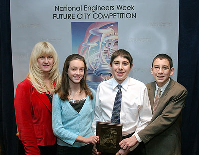 A team from Valley Middle School in Oakland, NJ, won FHWA's transportation award at this year's Future City  competition. Shown accepting the award (left to right) are the students'  teacher Judith Vihonski, and students Alicia Henneberry, Michael Ahrendt, and Bryan Jarmusch.