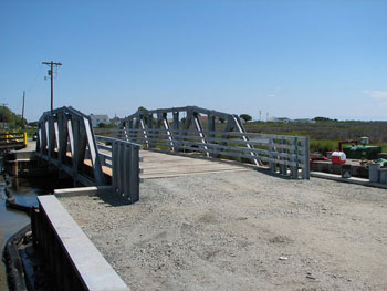 VDOT will use $400,000 in IBRC funds to help defray the cost of replacing two timber bridges on  Tangier Island, one of which is shown here with a temporary timber deck. - Photo Credit: VDOT