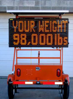 Message signs such as the one shown here alert truck drivers to their vehicle's weight, effectively directing them around the  Waldo-Hancock Bridge  if they weigh more than 45,359 kilograms (100,000 pounds). - Photo Credit: MaineDOT