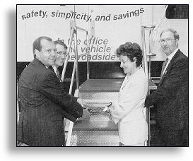 Jeff Lindley, Denny Judyicki, and George Reagle join Jane Garvey at the Technology Truck ribbon cutting in June.