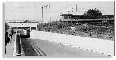 Photo of a grade-separated crossing in the Netherlands that accommodates pedestrians, vehicles and cyclists.