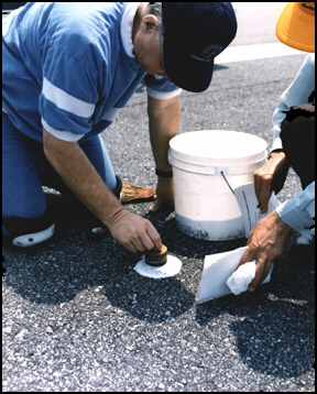 Men using ROSAN, manual pavement testing