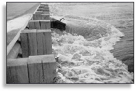 flooding on the Minnesota River uncuts this bridge abutment